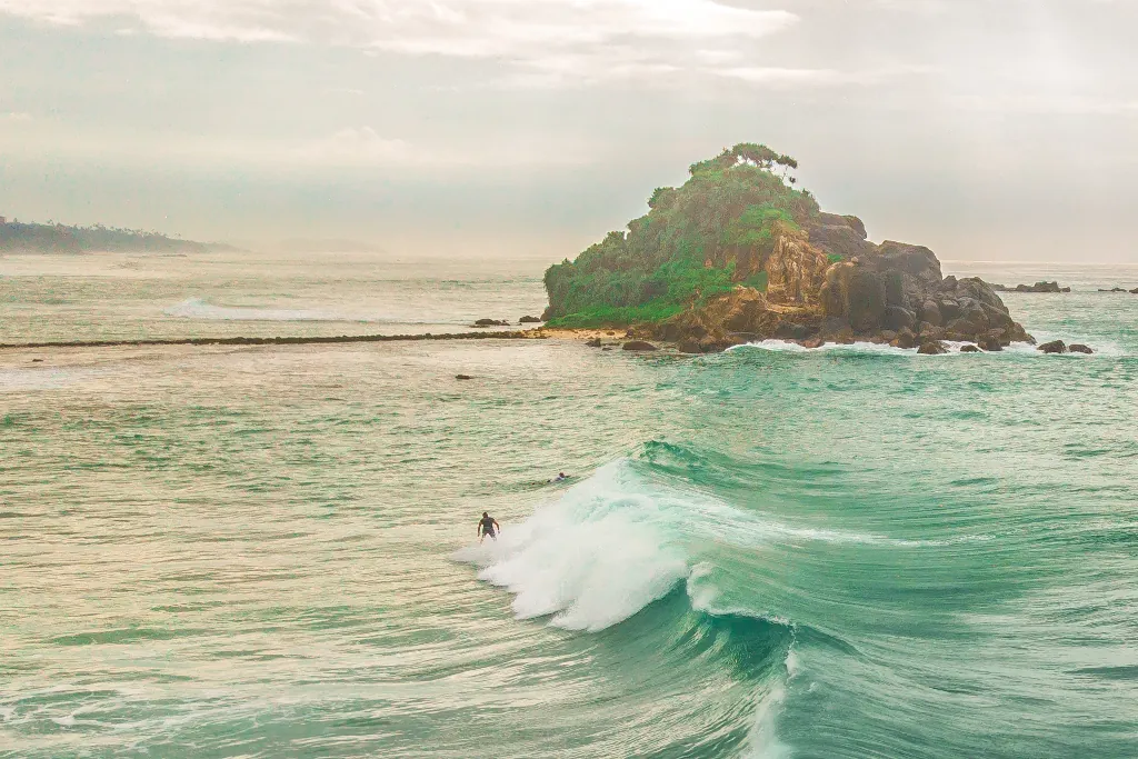 a surfer at Island point in Sri Lanka