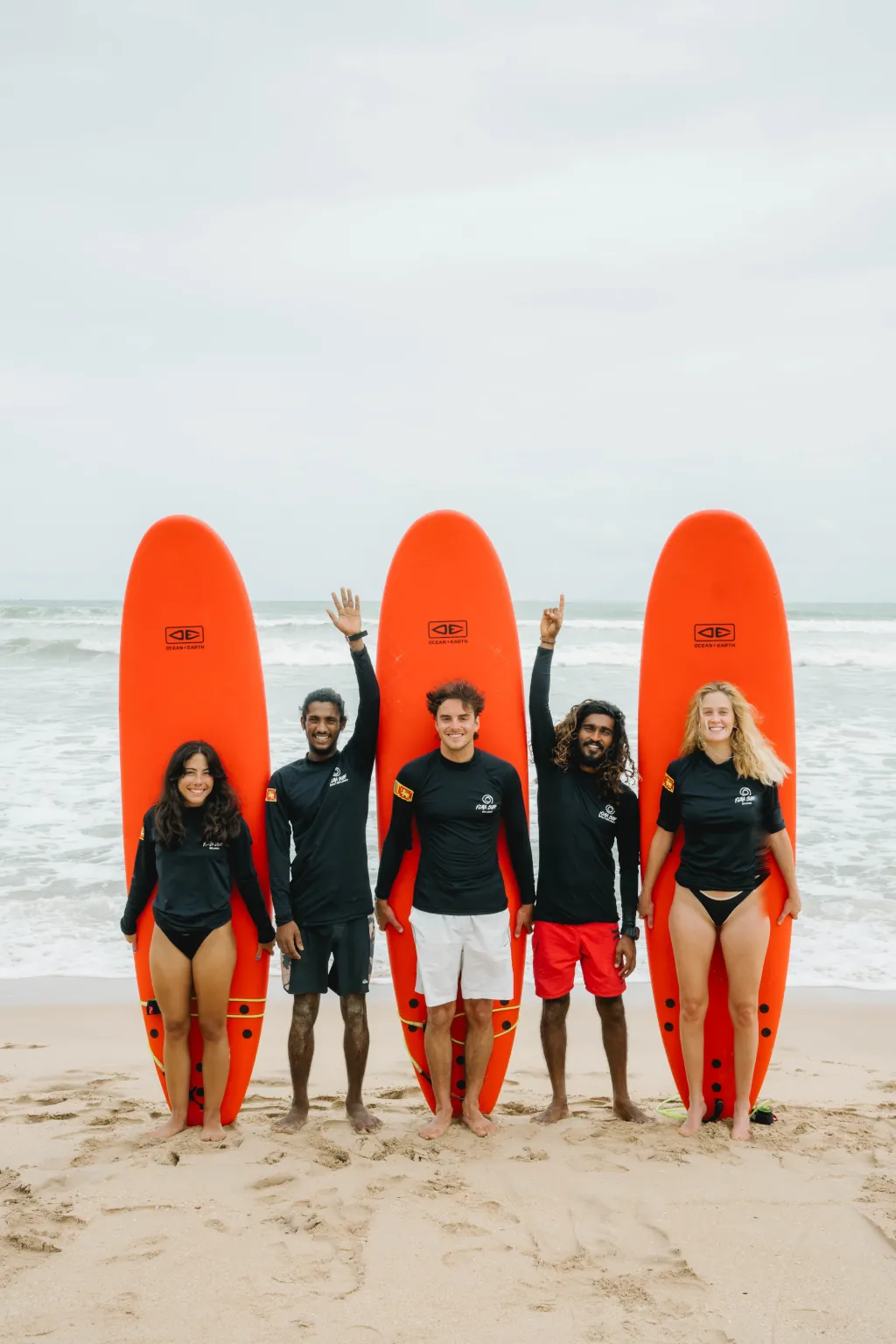 Happy group of beginner surfers in Weligama