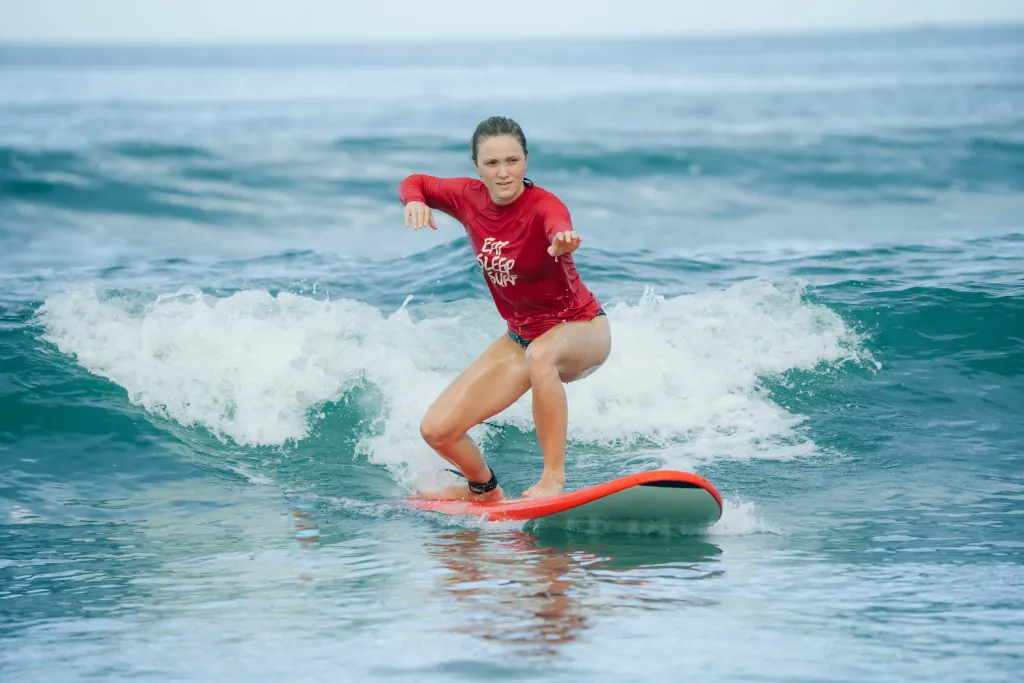 beginner surfer focussed on her wave