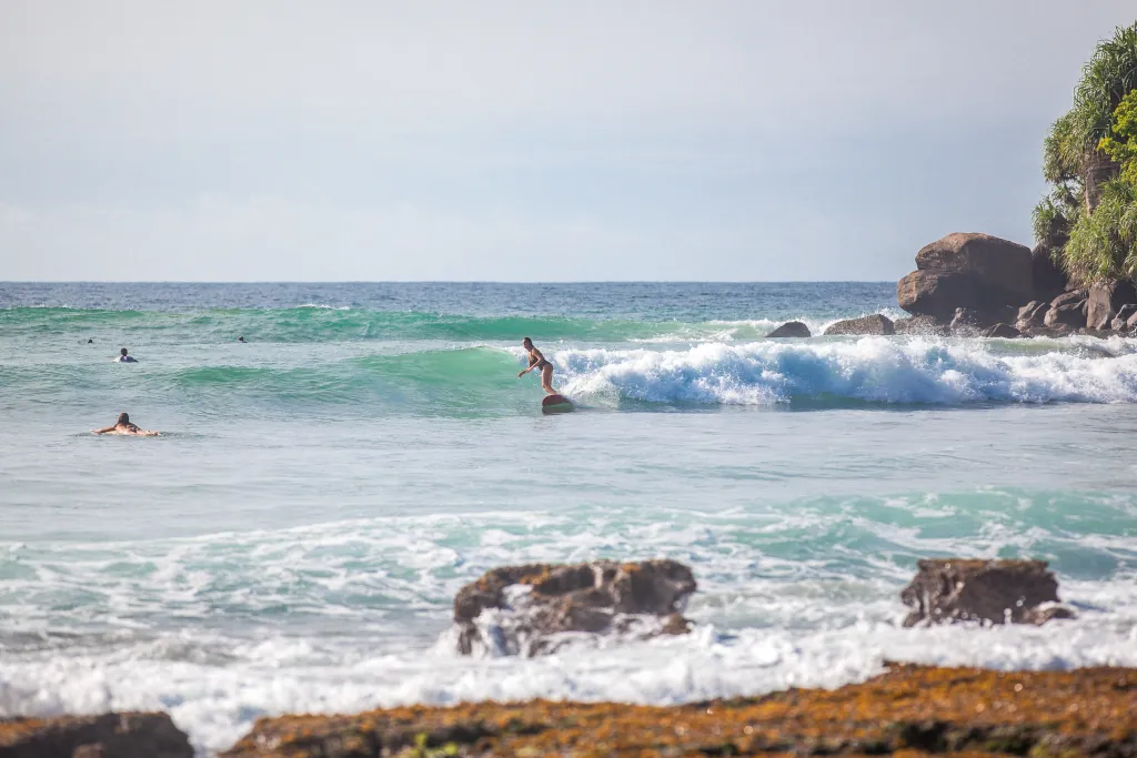 surfers at Mirissa beach