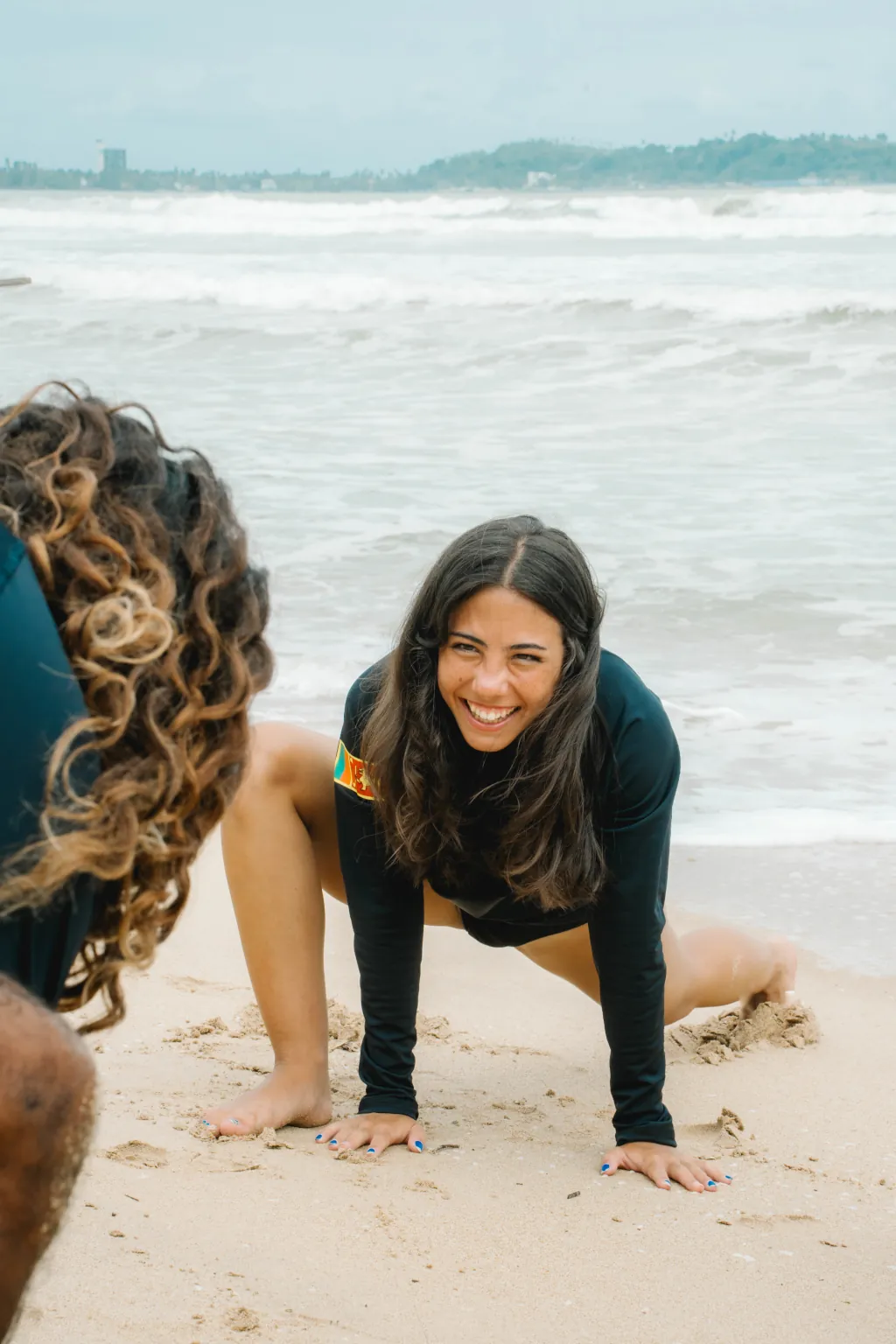 Happy beginner surfer at our Learn-To-Surf School in Sri Lanka