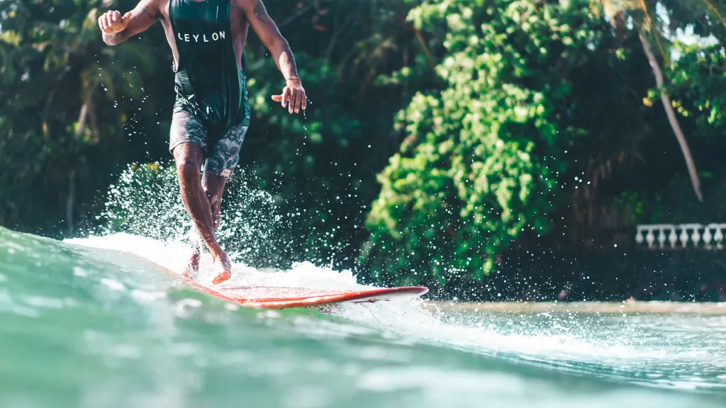 surfers surfing the waves in Hiriketiya bay