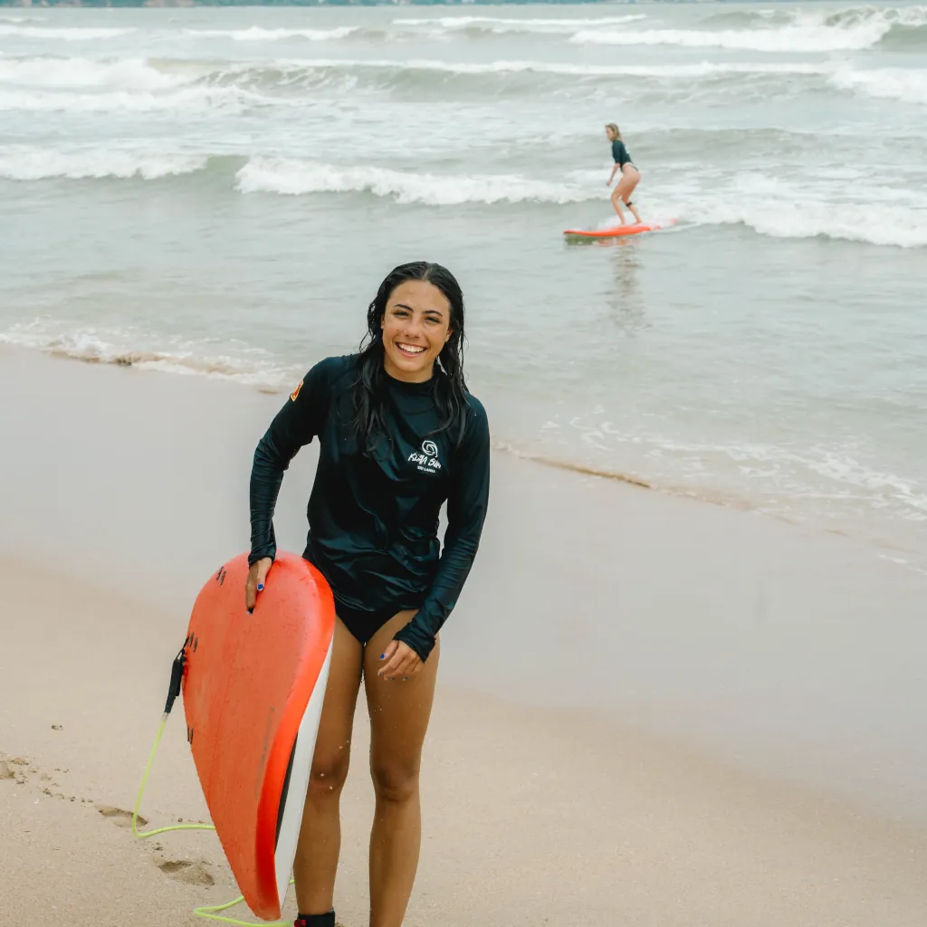 A happy beginner surfer in Weligama