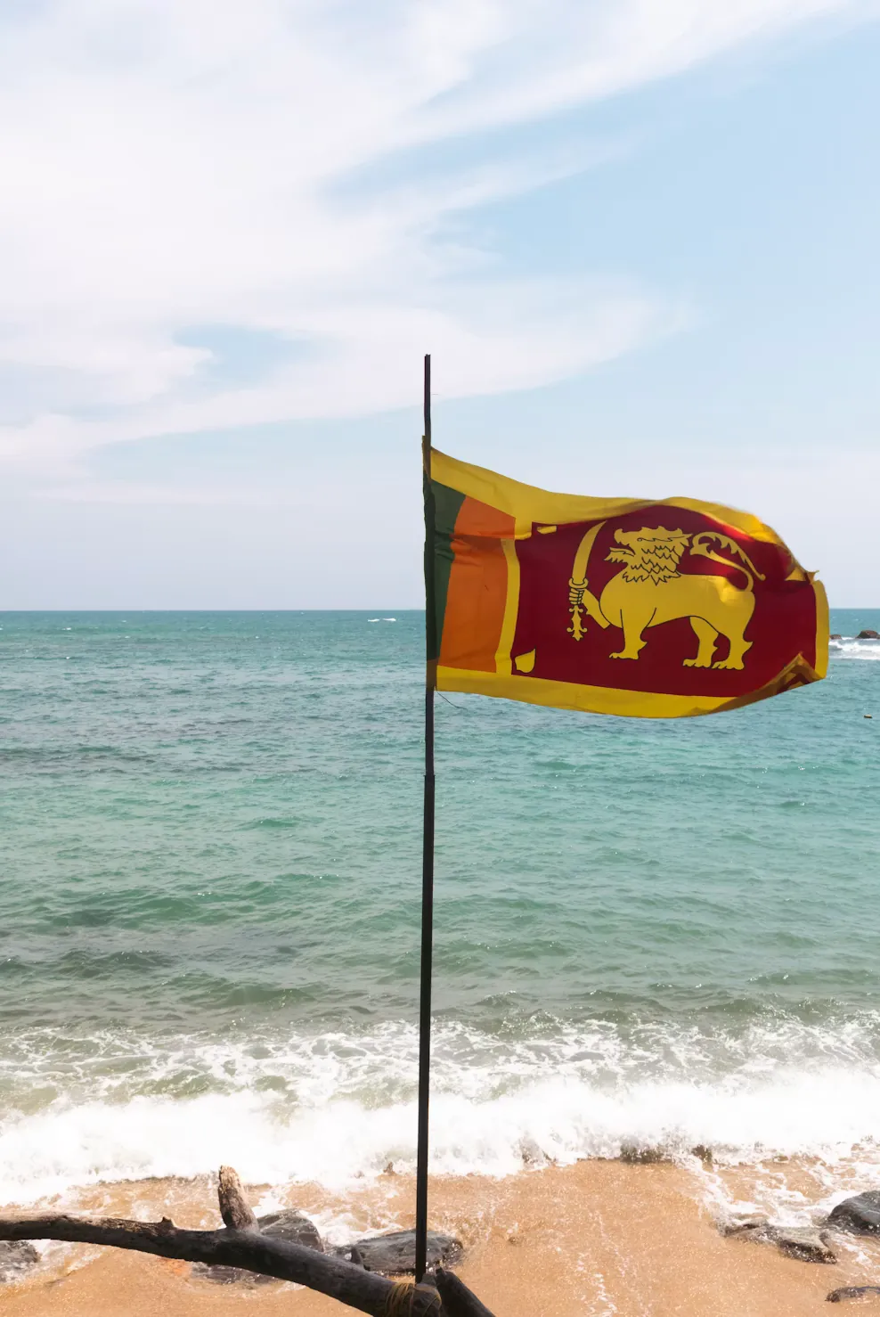 Sri Lankan flag in front of the ocean