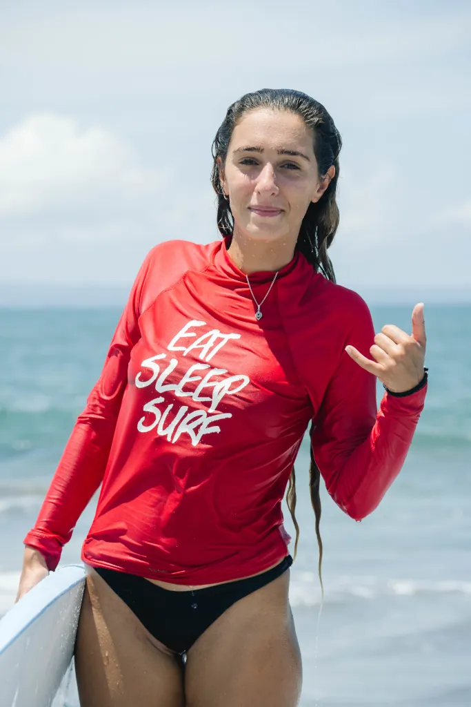 beginner surfer making a shaka sign
