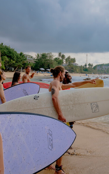 SURFERS GOING TO A SESSION - SRI LANKA